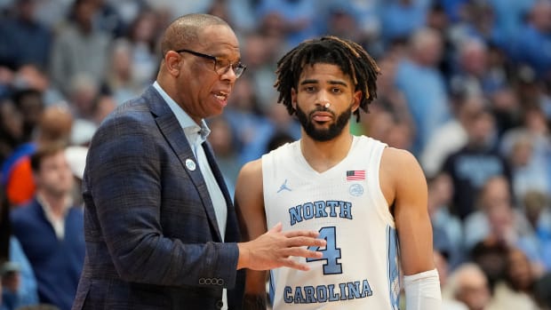 UNC basketball head coach Hubert Davis and guard RJ Davis